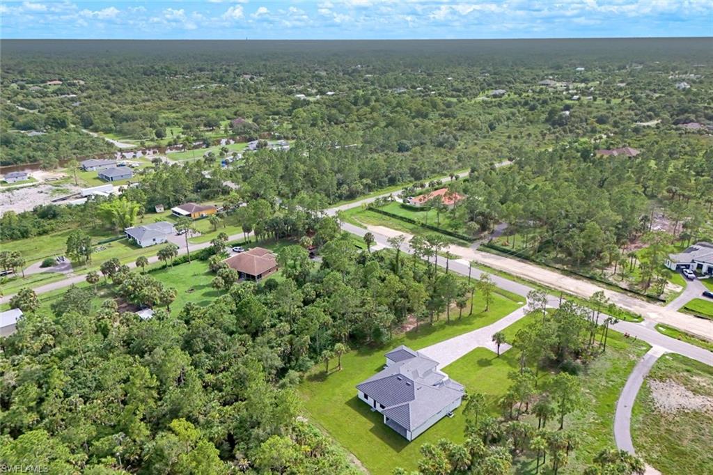1068 16th Street Northeast Naples, FL 34120 - Photo 33 of 35 a view of a yard with an outdoor seating