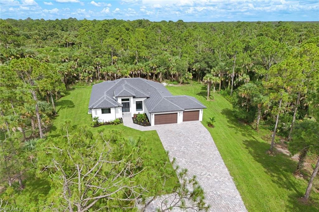 1068 16th Street Northeast Naples, FL 34120 - Photo 34 of 35 a aerial view of a house with a yard
