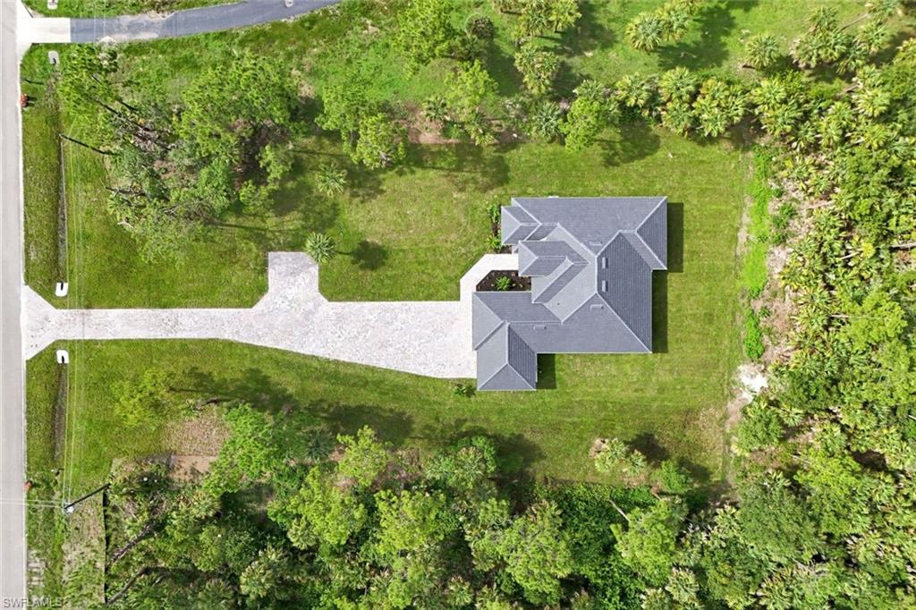 1068 16th Street Northeast Naples, FL 34120 - Photo 35 of 35 an aerial view of a house with a garden