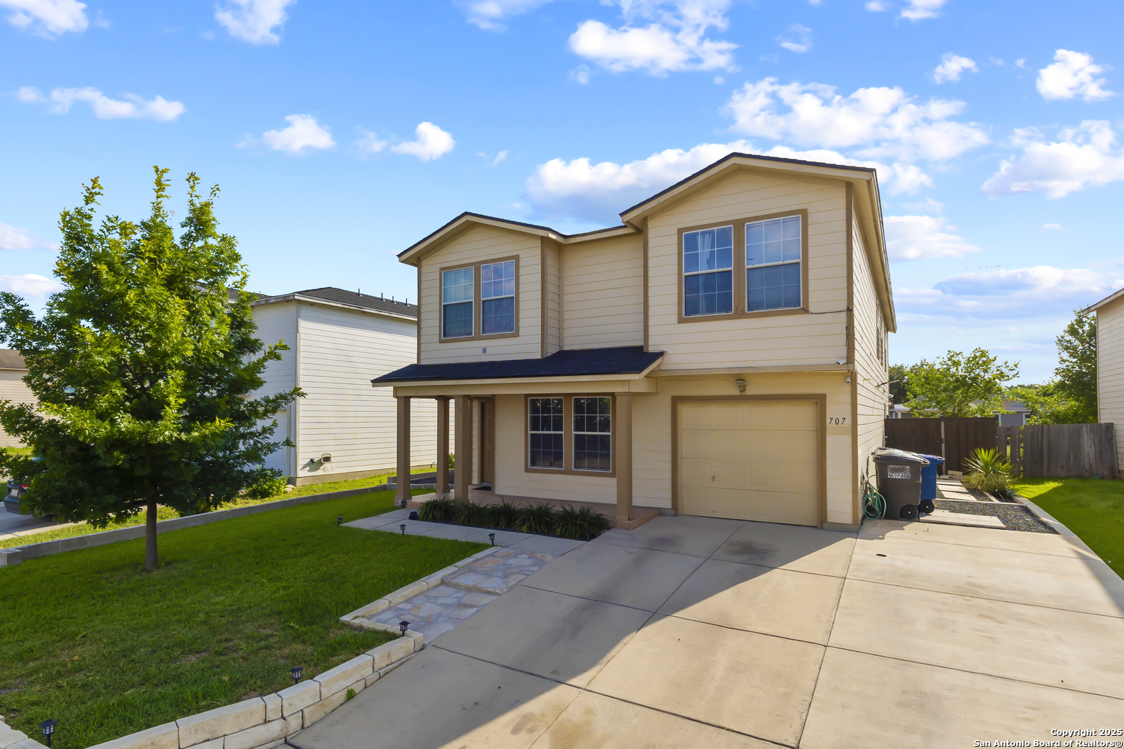 a front view of a house with a yard
