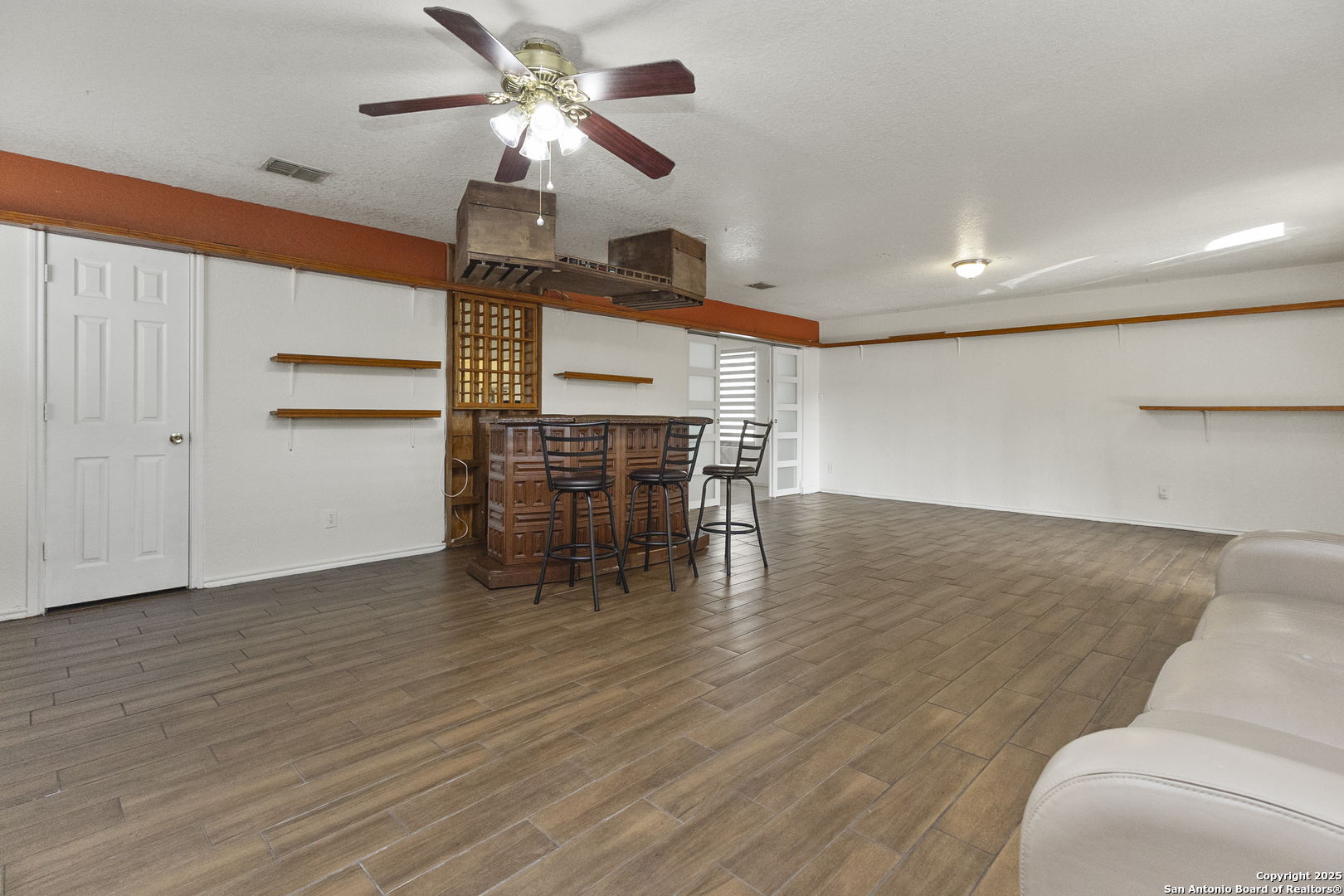 707 Ridingate Farm San Antonio, TX 78228 - Photo 11 of 30 a view of a livingroom with furniture and wooden floor