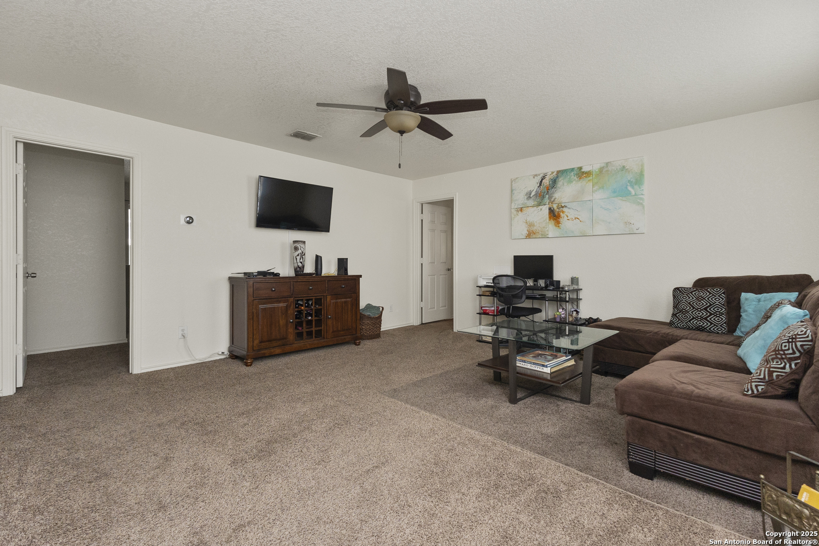 707 Ridingate Farm San Antonio, TX 78228 - Photo 12 of 30 a living room with furniture and a flat screen tv