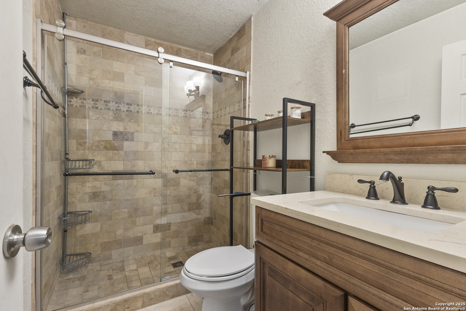 707 Ridingate Farm San Antonio, TX 78228 - Photo 16 of 30 a bathroom with a sink toilet and shower