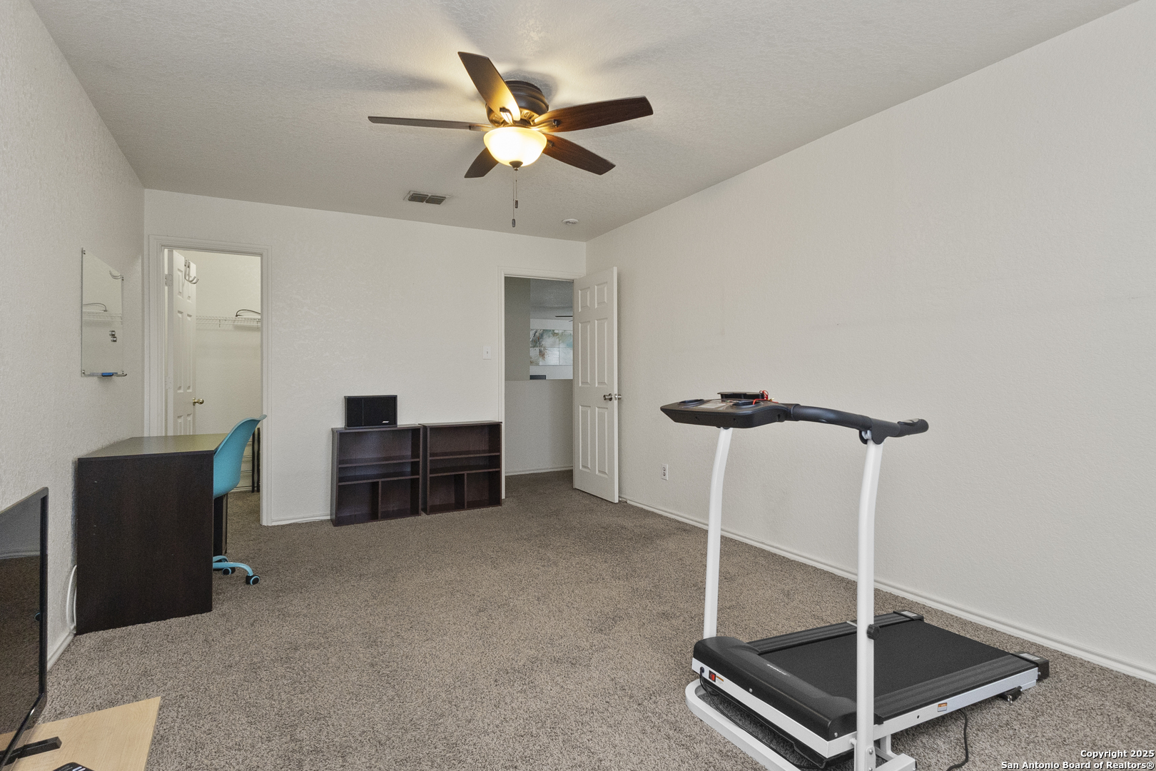 707 Ridingate Farm San Antonio, TX 78228 - Photo 18 of 30 a room with furniture and a ceiling fan