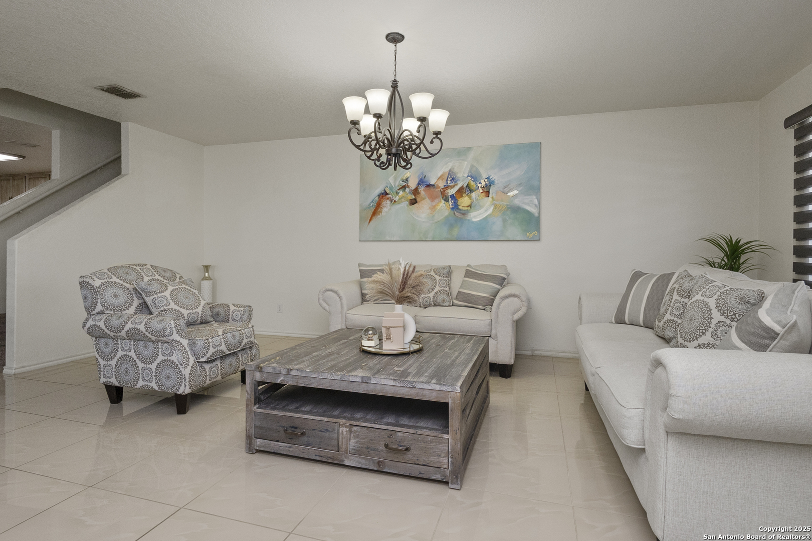 707 Ridingate Farm San Antonio, TX 78228 - Photo 3 of 30 a living room with furniture and a chandelier