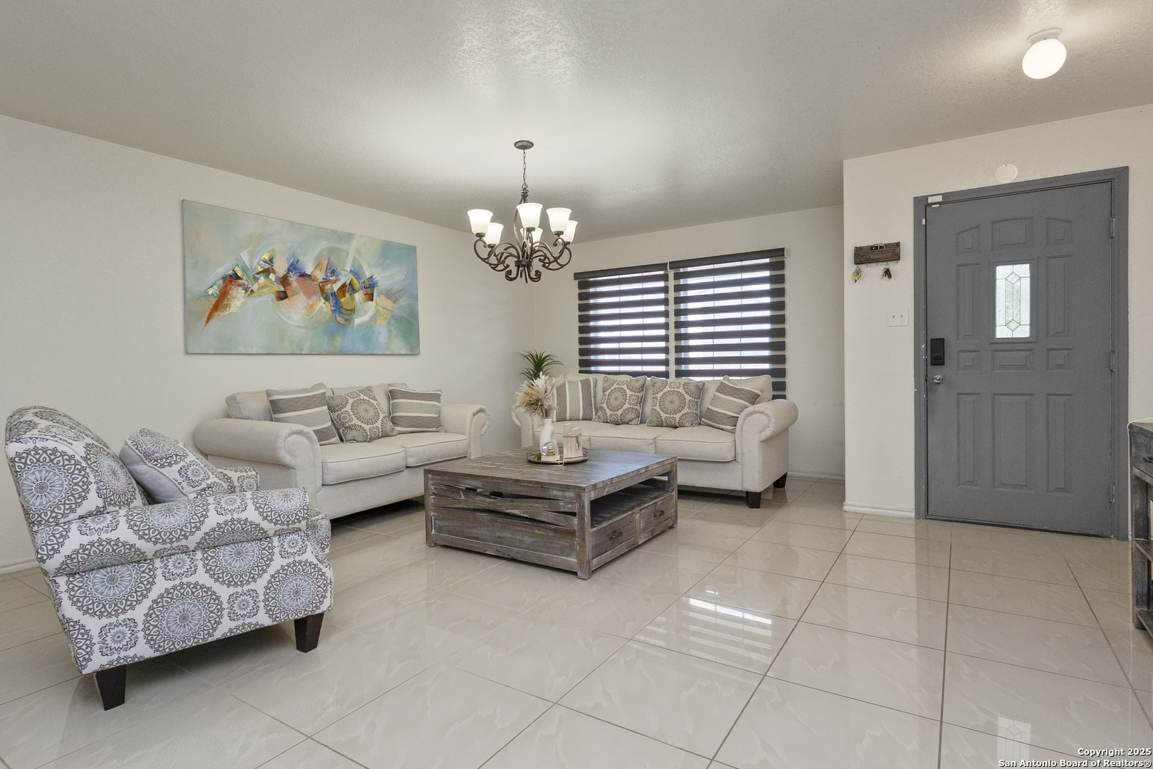 707 Ridingate Farm San Antonio, TX 78228 - Photo 4 of 30 a living room with furniture and a chandelier