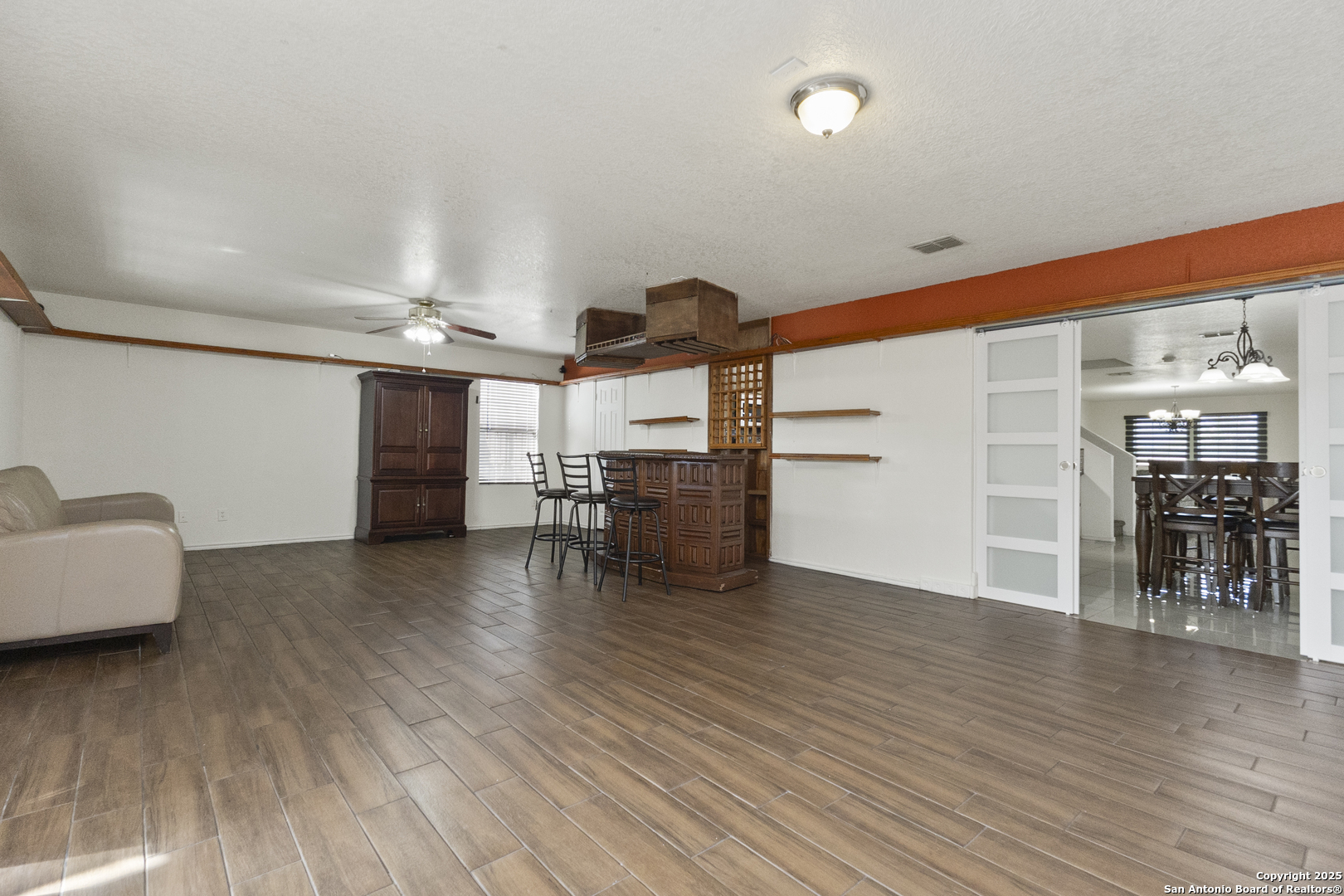 707 Ridingate Farm San Antonio, TX 78228 - Photo 10 of 30 a view of a livingroom with furniture and wooden floor
