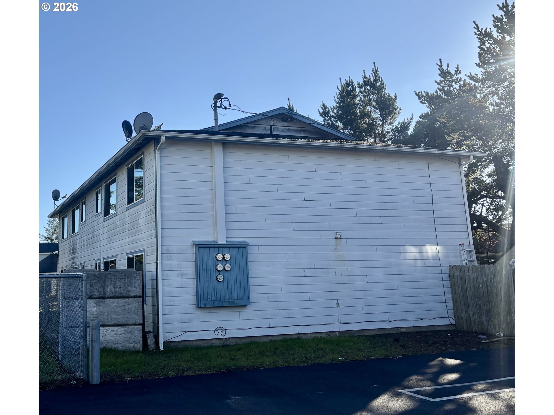 1675 22nd Street Florence, OR 97439 - Photo 5 of 7 a front view of a house with a yard