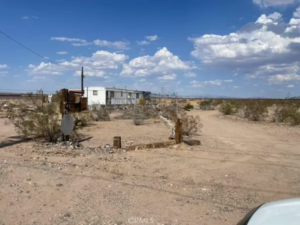 a view of a road with a building in the background
