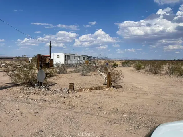 a view of a road with a building in the background