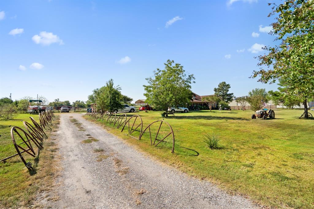 712 East Cook Street Josephine, TX 75189 - Photo 19 of 19 a view of swimming pool with outdoor seating and trees in the background