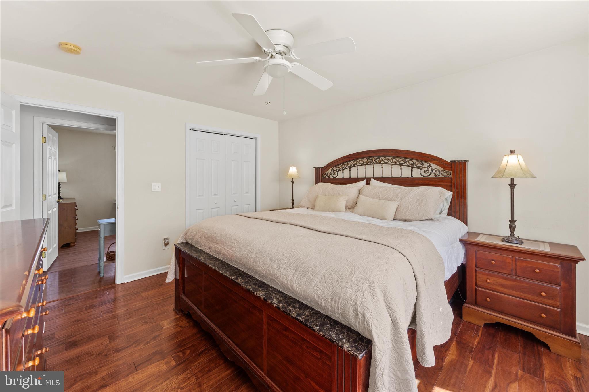 2032 Pondtown Road Chestertown, MD 21620 - Photo 17 of 32 a bedroom with a bed and wooden floor