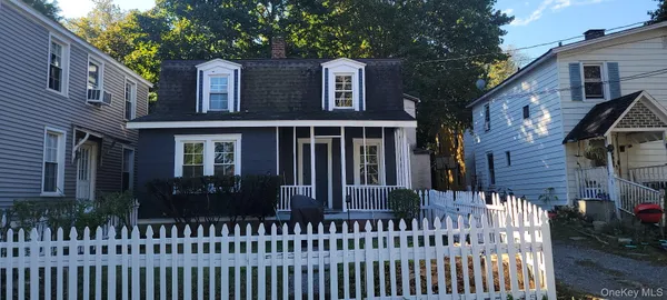a view of a house with a small yard