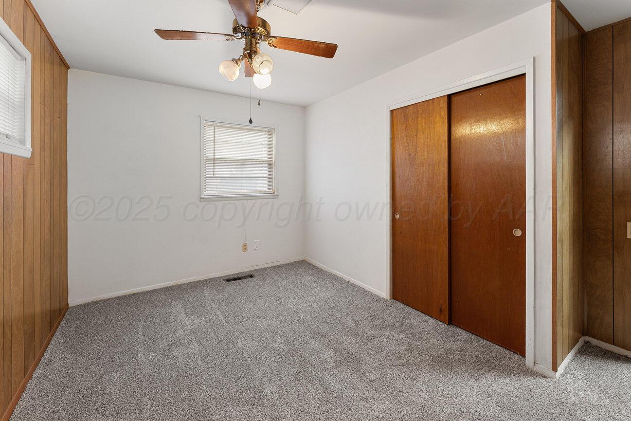 1133 Elmore Street Borger, TX 79007 - Photo 36 of 43 an empty room with windows and fan