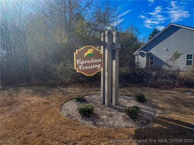 a view of kitchen with furniture and stainless steel appliances