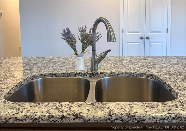 a living room with a fireplace and a window