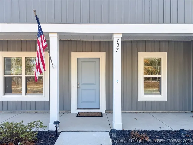 a front view of a house with a garage