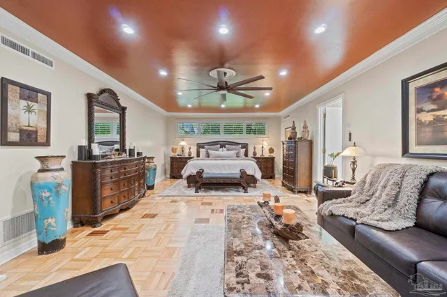 a living room with furniture a rug and a chandelier