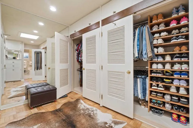 a bathroom with a granite countertop tub sink and mirror