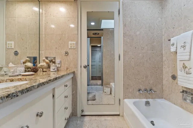 a bathroom with a toilet a sink and a bathtub