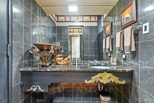 a view of a patio with table and chairs potted plants with wooden floor and fence