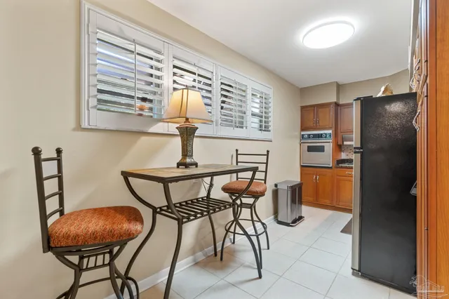 a view of a swimming pool with a patio and a yard