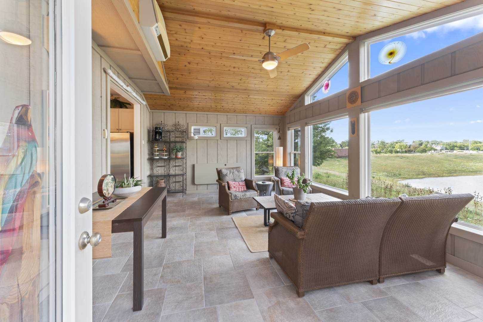 566 West Bridge View Court Palatine, IL 60067 - Photo 16 of 41 a living room with furniture and a floor to ceiling window