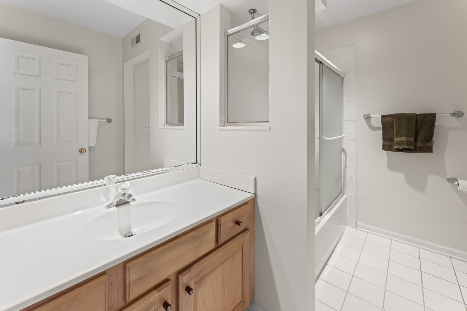 566 West Bridge View Court Palatine, IL 60067 - Photo 22 of 41 a bathroom with a sink and a mirror