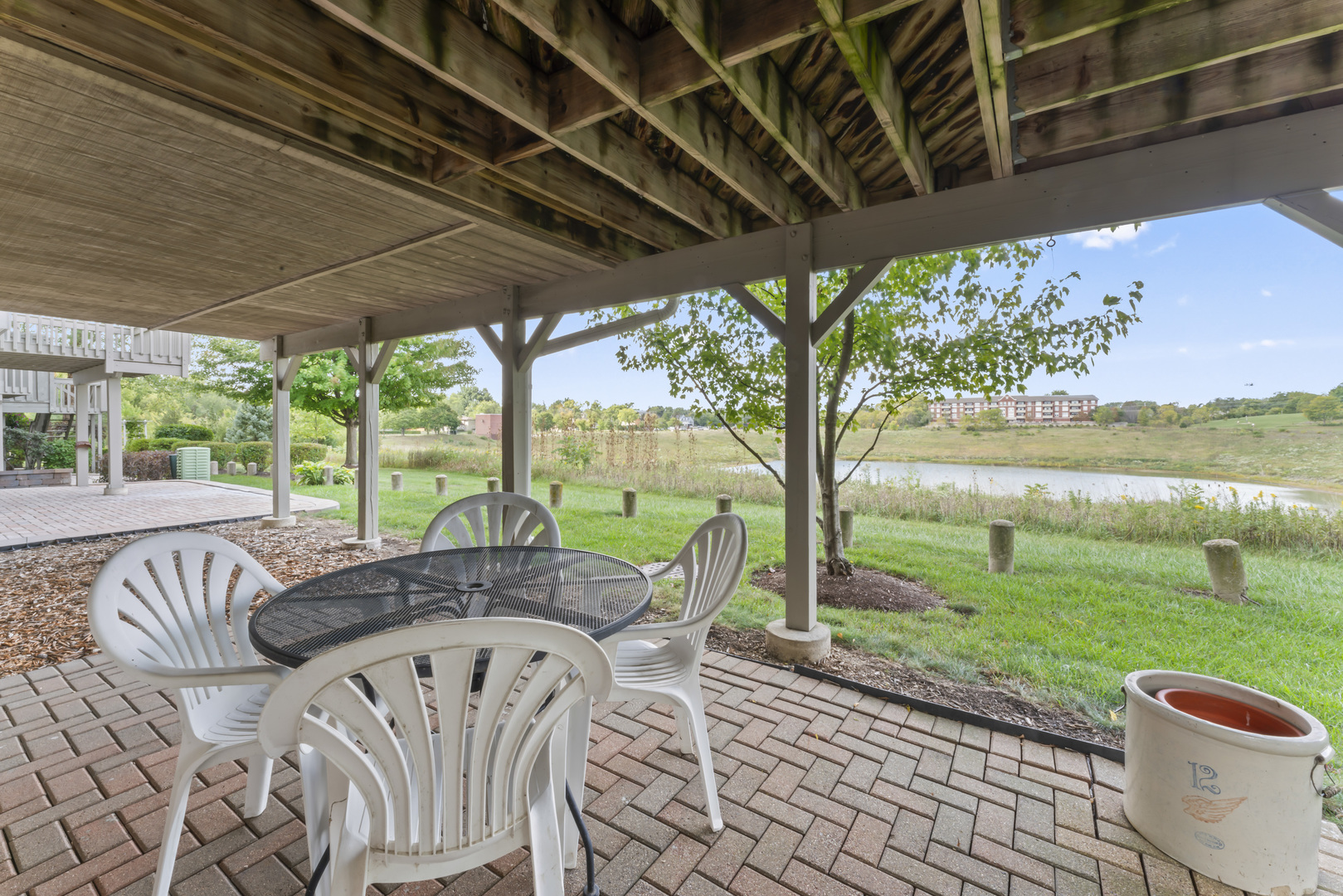 566 West Bridge View Court Palatine, IL 60067 - Photo 30 of 41 a view of a patio with a table chairs and a backyard