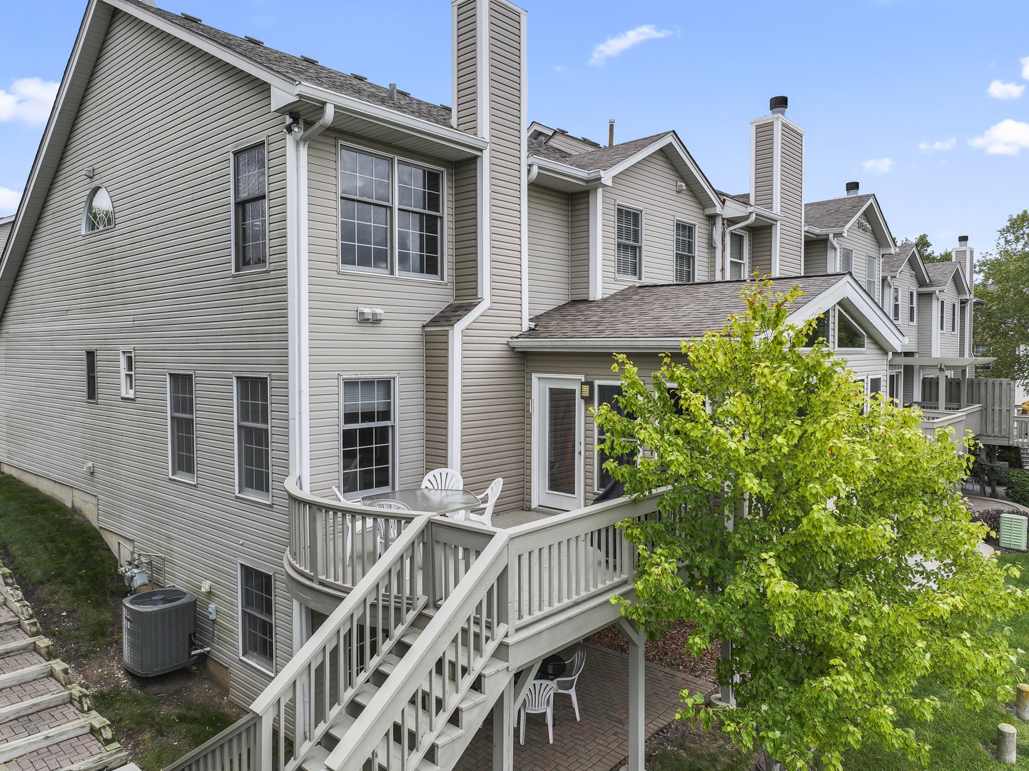 566 West Bridge View Court Palatine, IL 60067 - Photo 32 of 41 a front view of a house with a garden