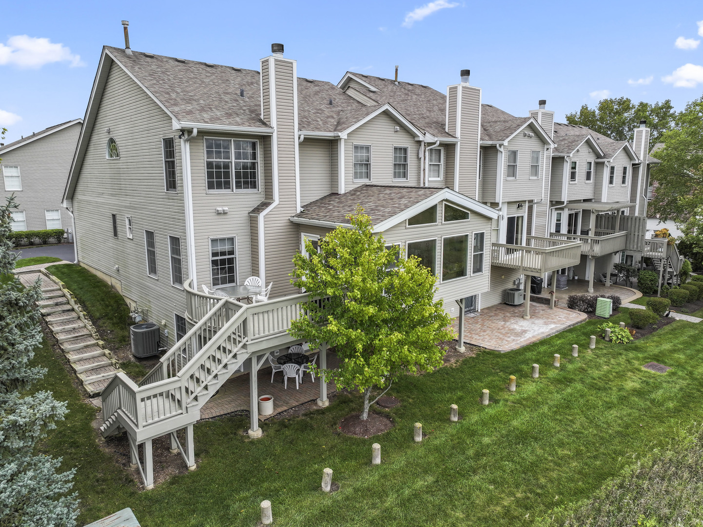566 West Bridge View Court Palatine, IL 60067 - Photo 33 of 41 a front view of a house with porch and garden