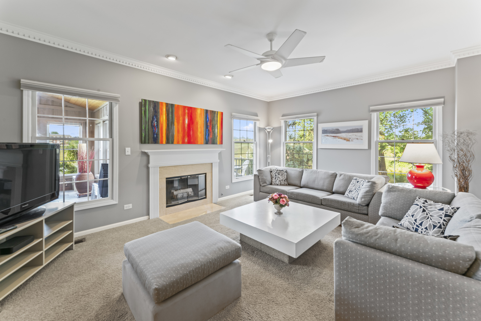 566 West Bridge View Court Palatine, IL 60067 - Photo 7 of 41 a living room with furniture a fireplace and a flat screen tv