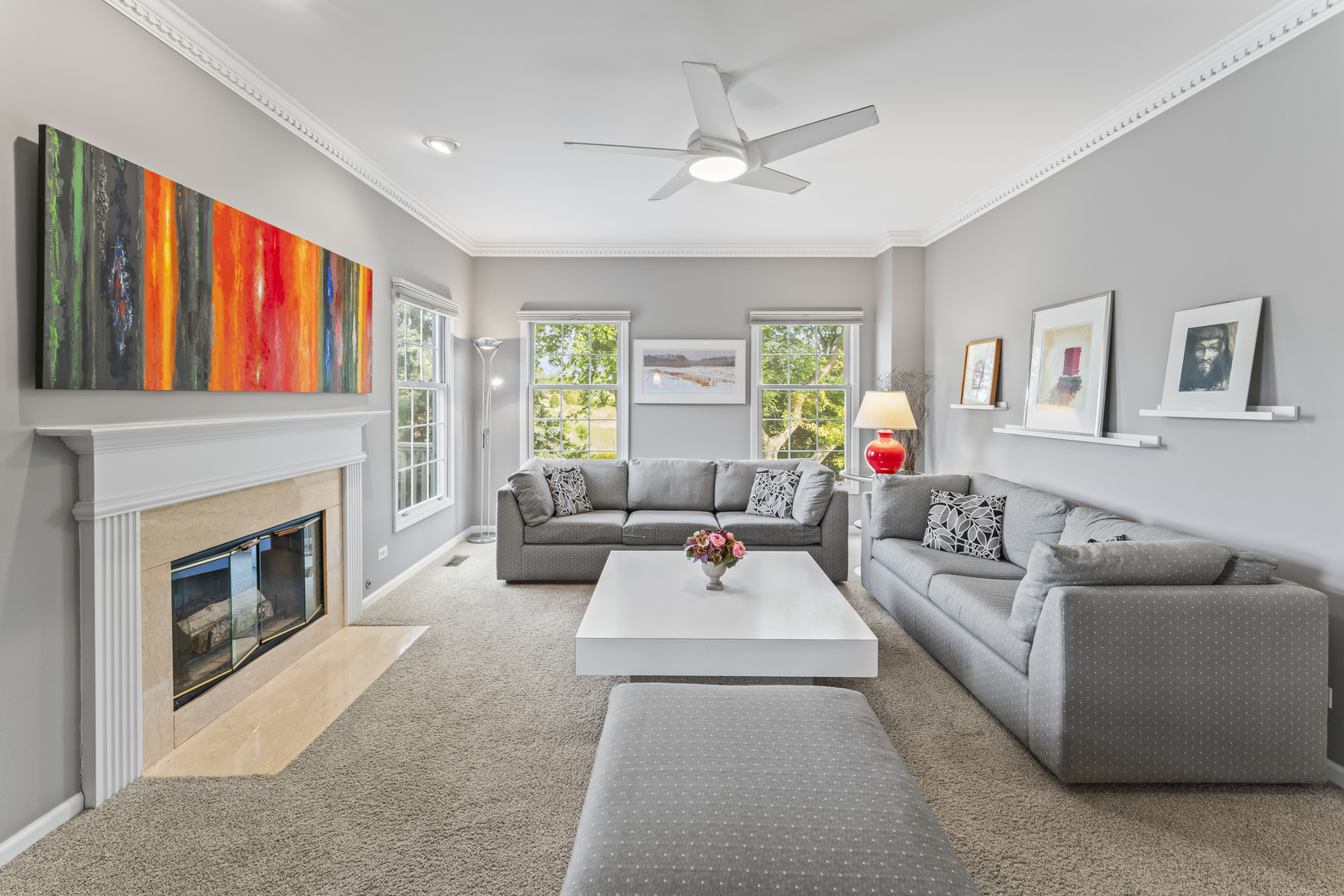 566 West Bridge View Court Palatine, IL 60067 - Photo 8 of 41 a living room with furniture a fireplace and a large window