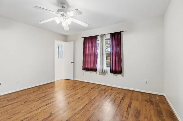 a bathroom with a sink and mirror with toilet