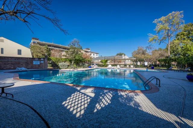 a view of a backyard with sitting area