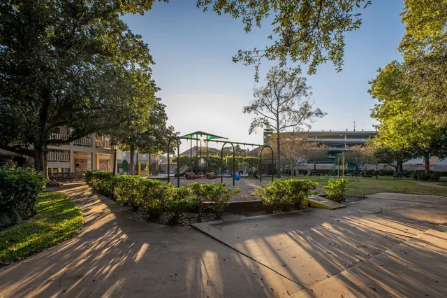 a view of a bench in a park