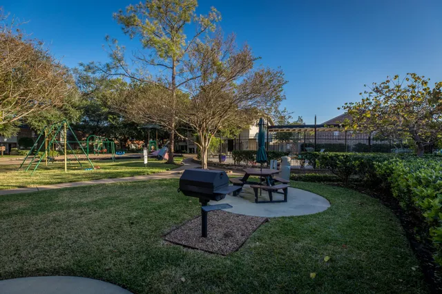 a view of a yard with chairs