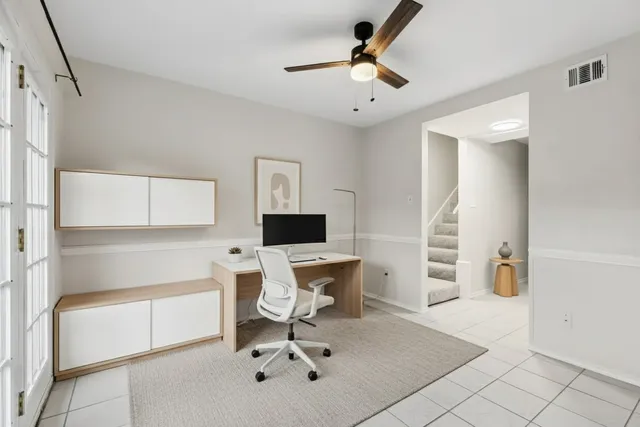 an empty room with a empty space and windows