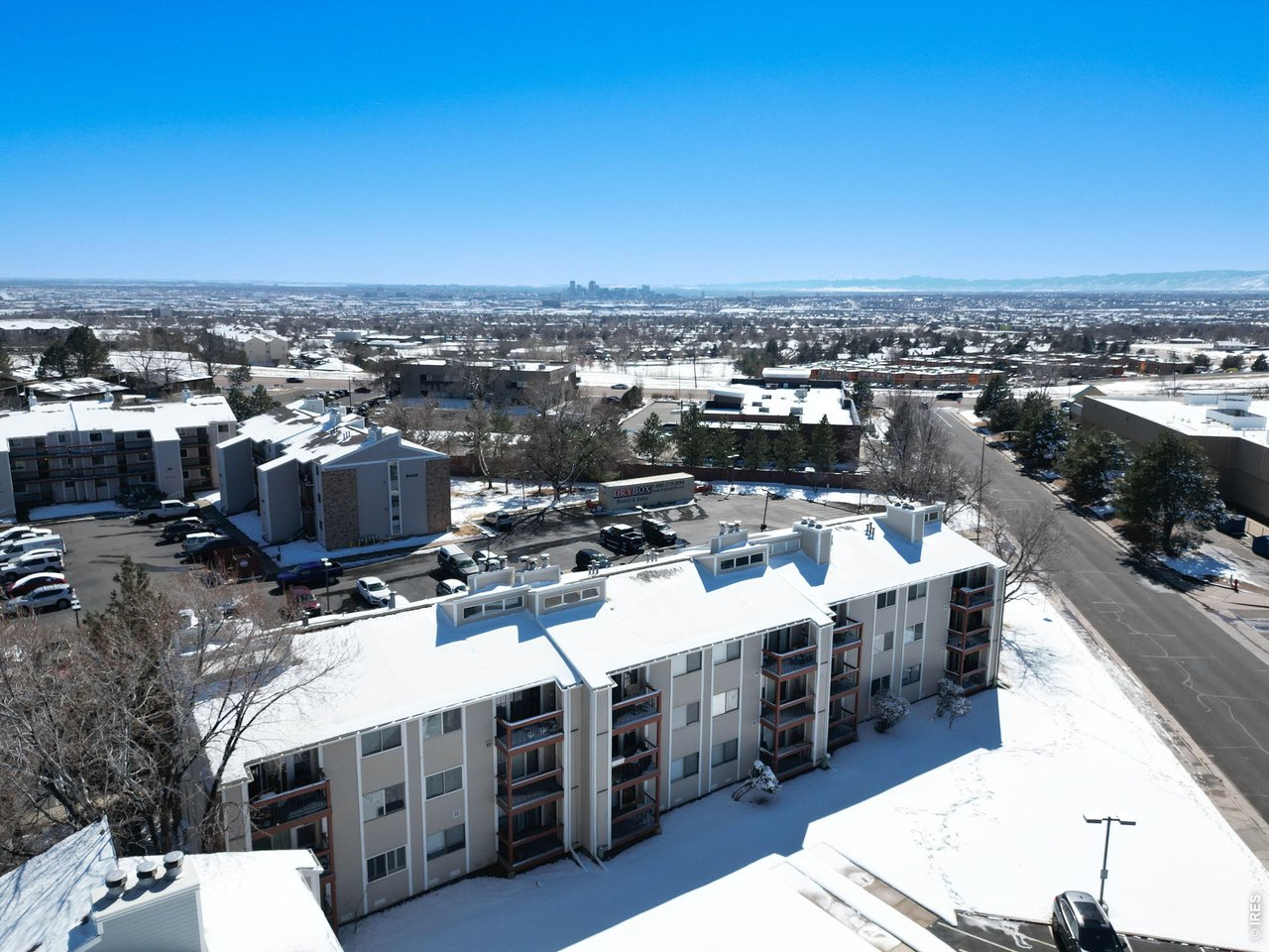 8460 Decatur Street, Unit 128 Westminster, CO 80031 - Photo 29 of 30 Aerial of building from the rear looking South with views of Downtown Denver