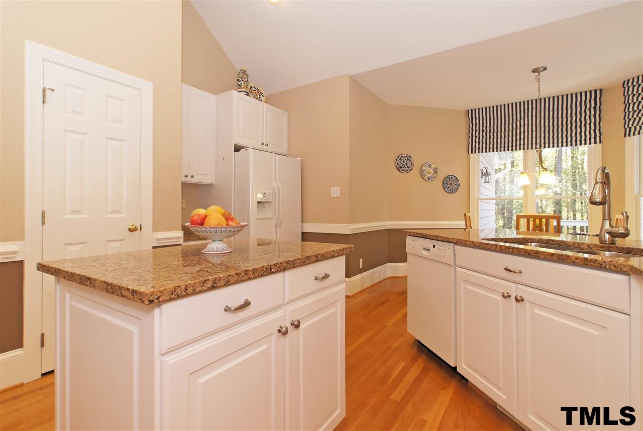 2321 Primrose Valley Court Raleigh, NC 27613 - Photo 8 of 24 KITCHEN W/GRANITE, GAS COOK TOP, WALL OVEN AND BUILT IN MICROWAVE!
