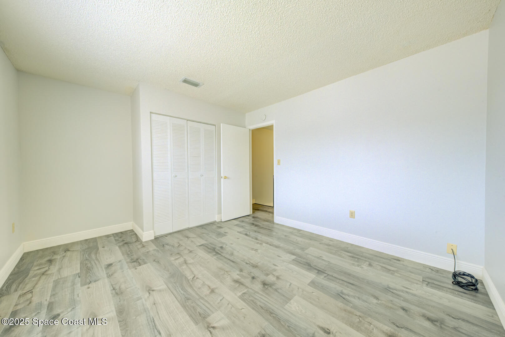 4749 Sisson Road Titusville, FL 32780 - Photo 22 of 30 bedroom 2 with vinyl plank floors