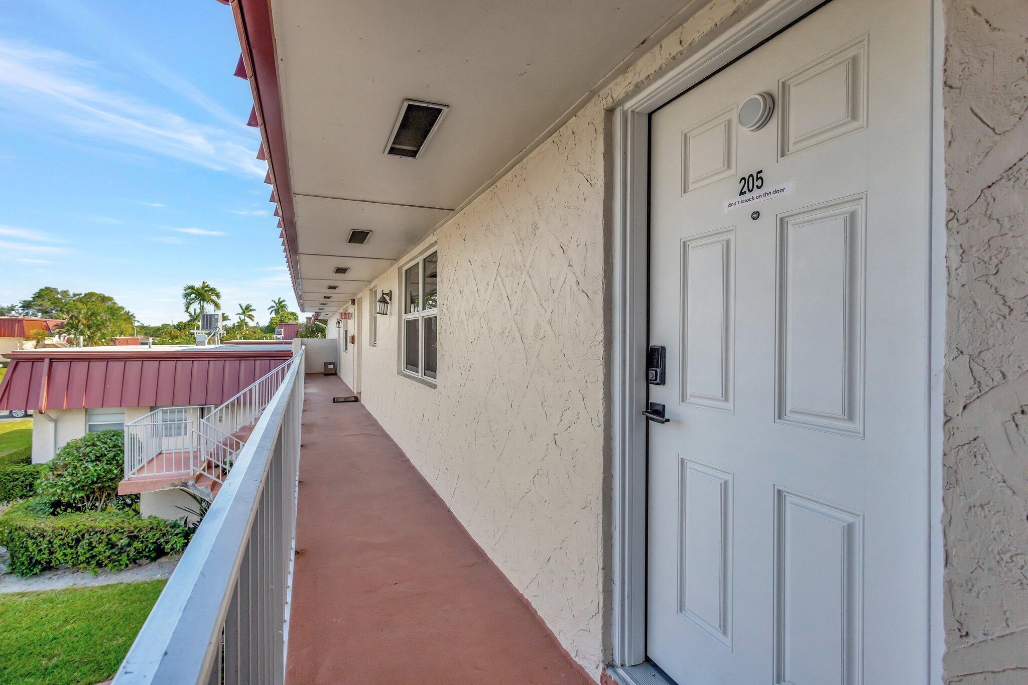 12012 Greenway Circle South, Unit 205 Royal Palm Beach, FL 33411 - Photo 8 of 36 a view of balcony with small plants
