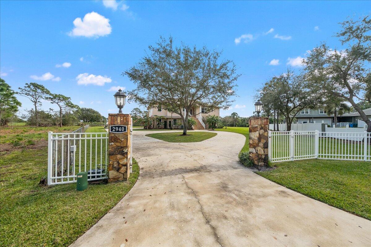 2940 Pomello Road Malabar, FL 32950 - Photo 2 of 42 a view of a garden with an outdoor space