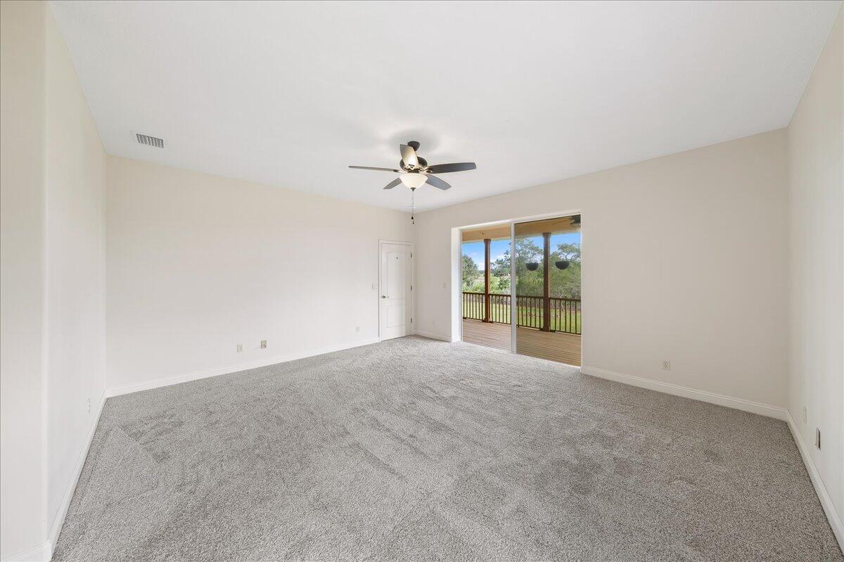 2940 Pomello Road Malabar, FL 32950 - Photo 26 of 42 a view of a livingroom with a ceiling fan and window