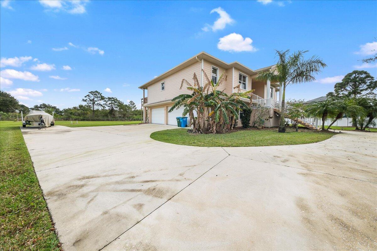 2940 Pomello Road Malabar, FL 32950 - Photo 3 of 42 a view of a house with a yard and potted plants