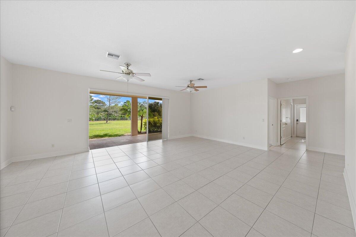 2940 Pomello Road Malabar, FL 32950 - Photo 30 of 42 wooden floor in an empty room with a window