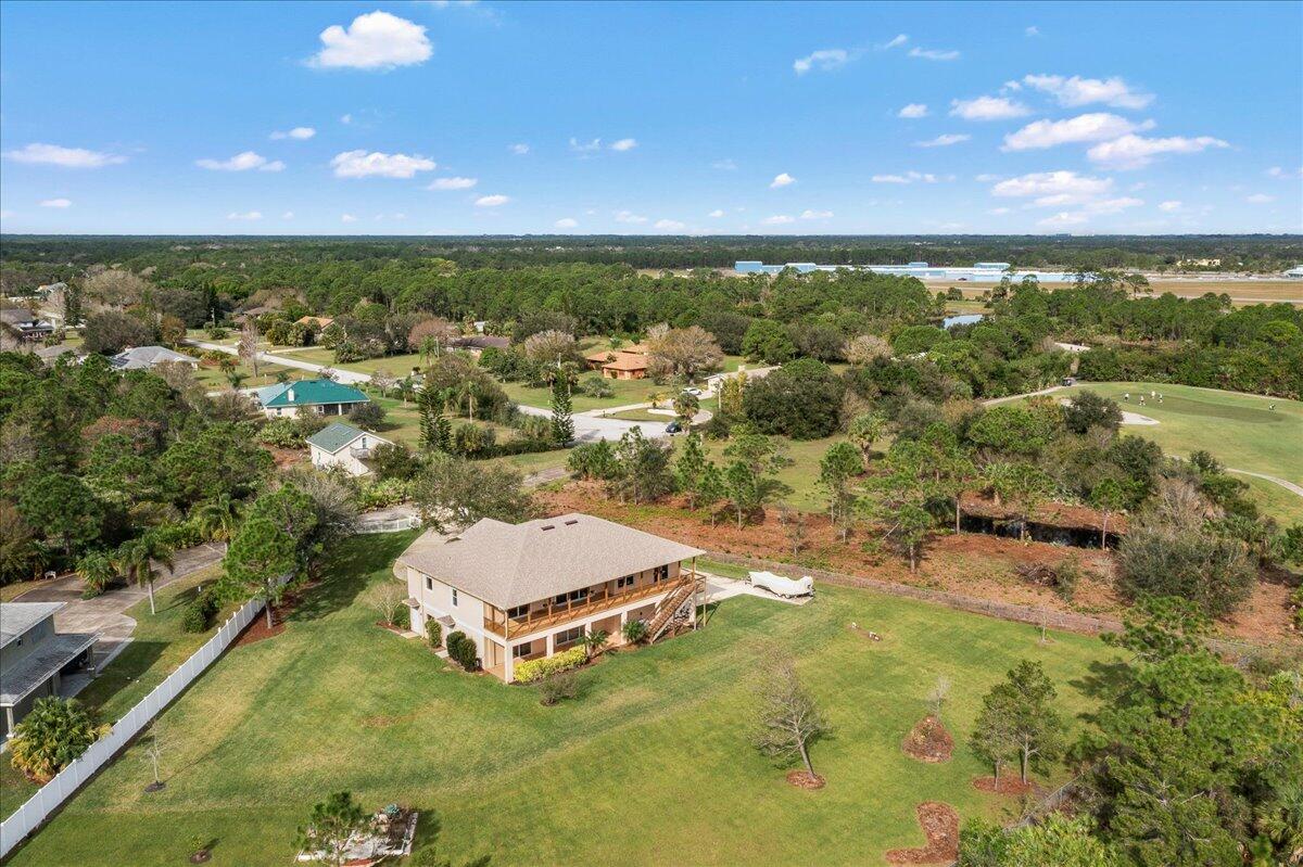 2940 Pomello Road Malabar, FL 32950 - Photo 37 of 42 an aerial view of residential houses with outdoor space and trees