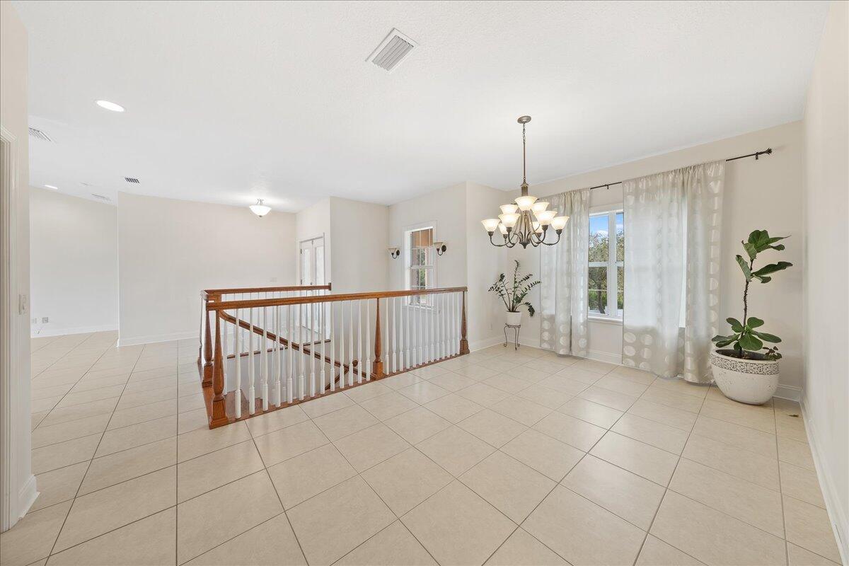 2940 Pomello Road Malabar, FL 32950 - Photo 9 of 42 a view of a room with window and chandelier