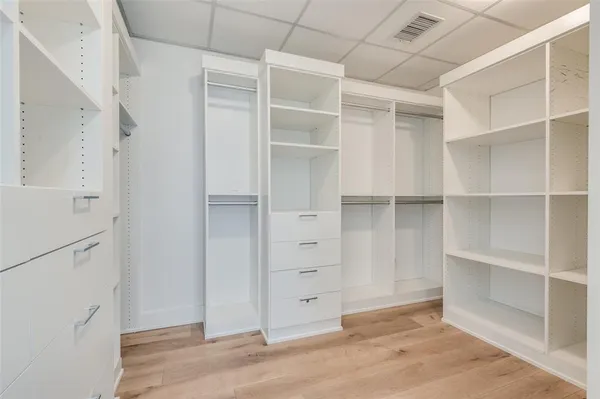 a view of an empty walk in closet