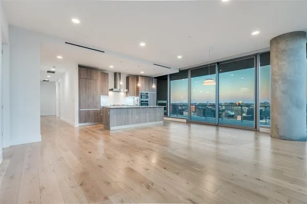 a view of a kitchen with large windows
